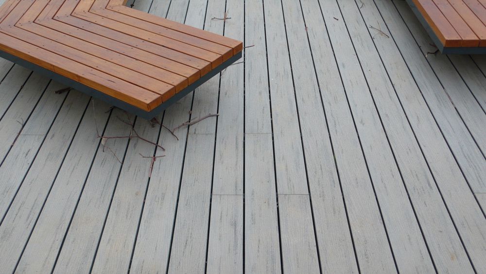 A Wooden Deck With Two Wooden Benches on It — B & B Timbers Ballina In West Ballina, NSW