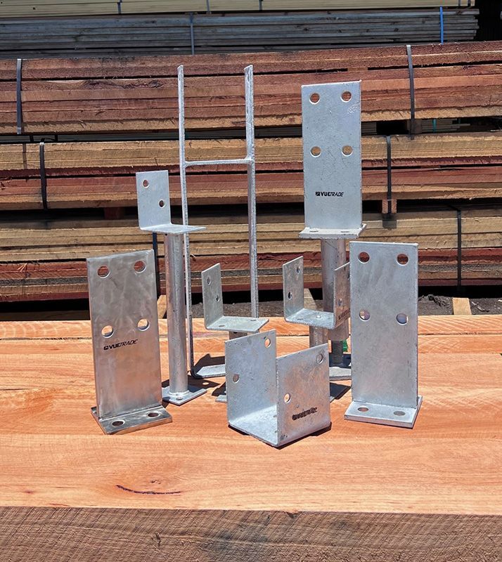 A Bunch of Metal Brackets Are Sitting on a Wooden Table — B & B Timbers Ballina In West Ballina, NSW