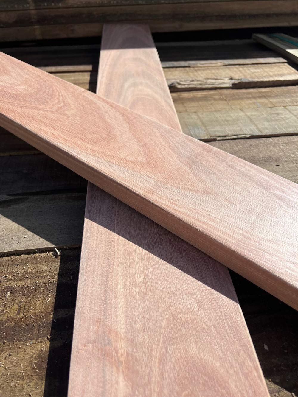 Two Pieces of Wood Are Laying on Top of Each Other on a Wooden Surface — B & B Timbers Ballina In West Ballina, NSW