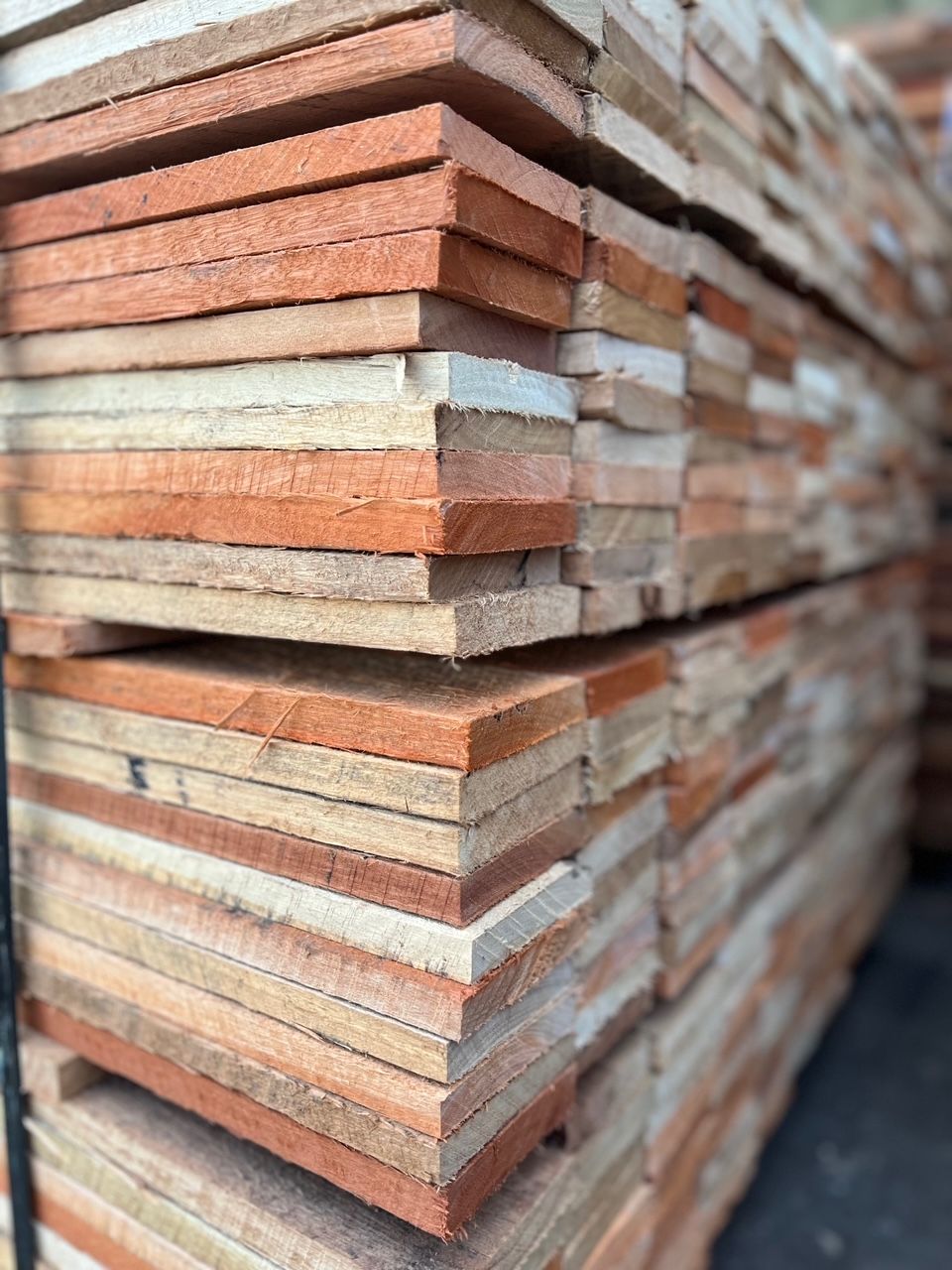 A Pile of Wooden Boards Stacked on Top of Each Other — B & B Timbers Ballina In West Ballina, NSW