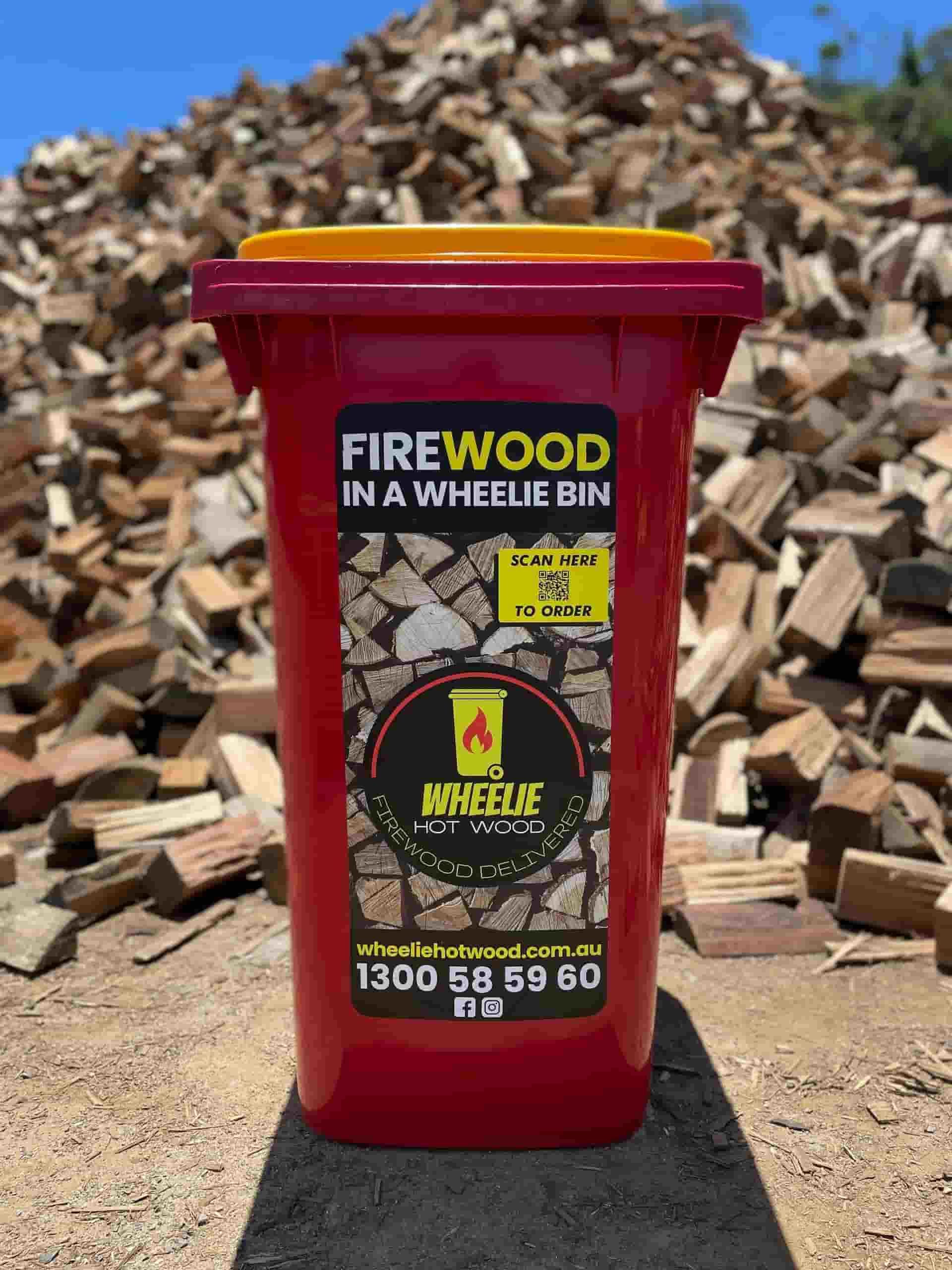 Wheelie Hot Wood Bin With Firewood in the Background — B & B Timbers Ballina In West Ballina, NSW