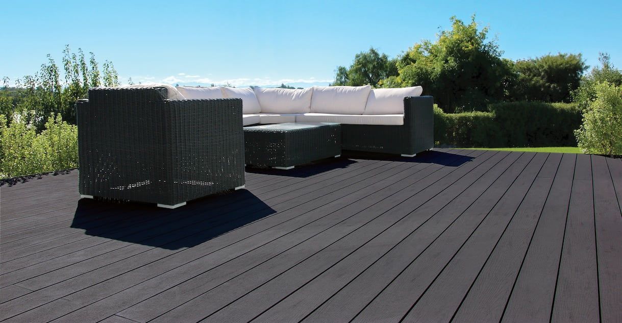 A Wooden Deck With a Couch and Chairs on It — B & B Timbers Ballina In West Ballina, NSW