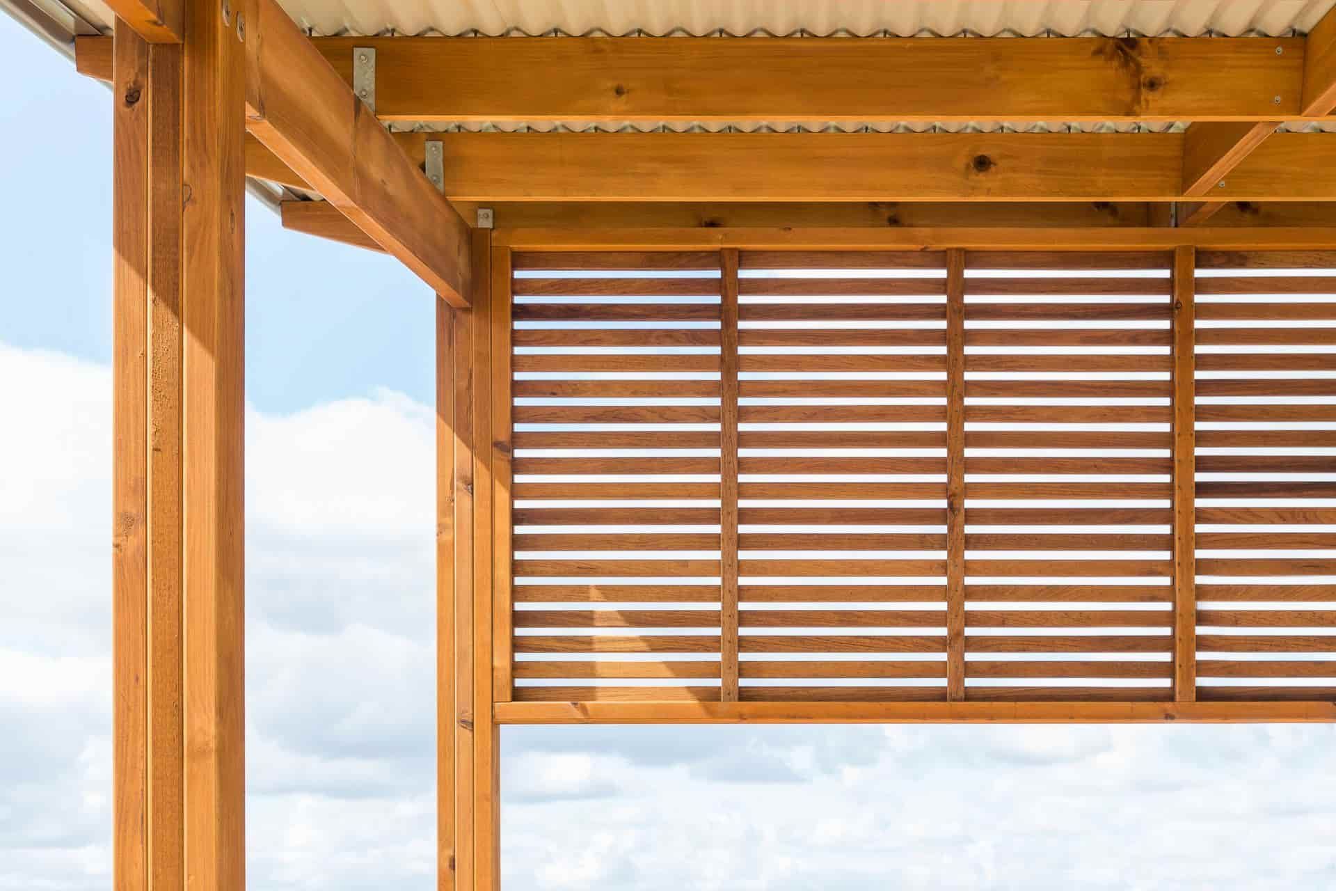 A Close Up of a Wooden Pergola With a Roof and a Sky in the Background — B & B Timbers Ballina In West Ballina, NSW