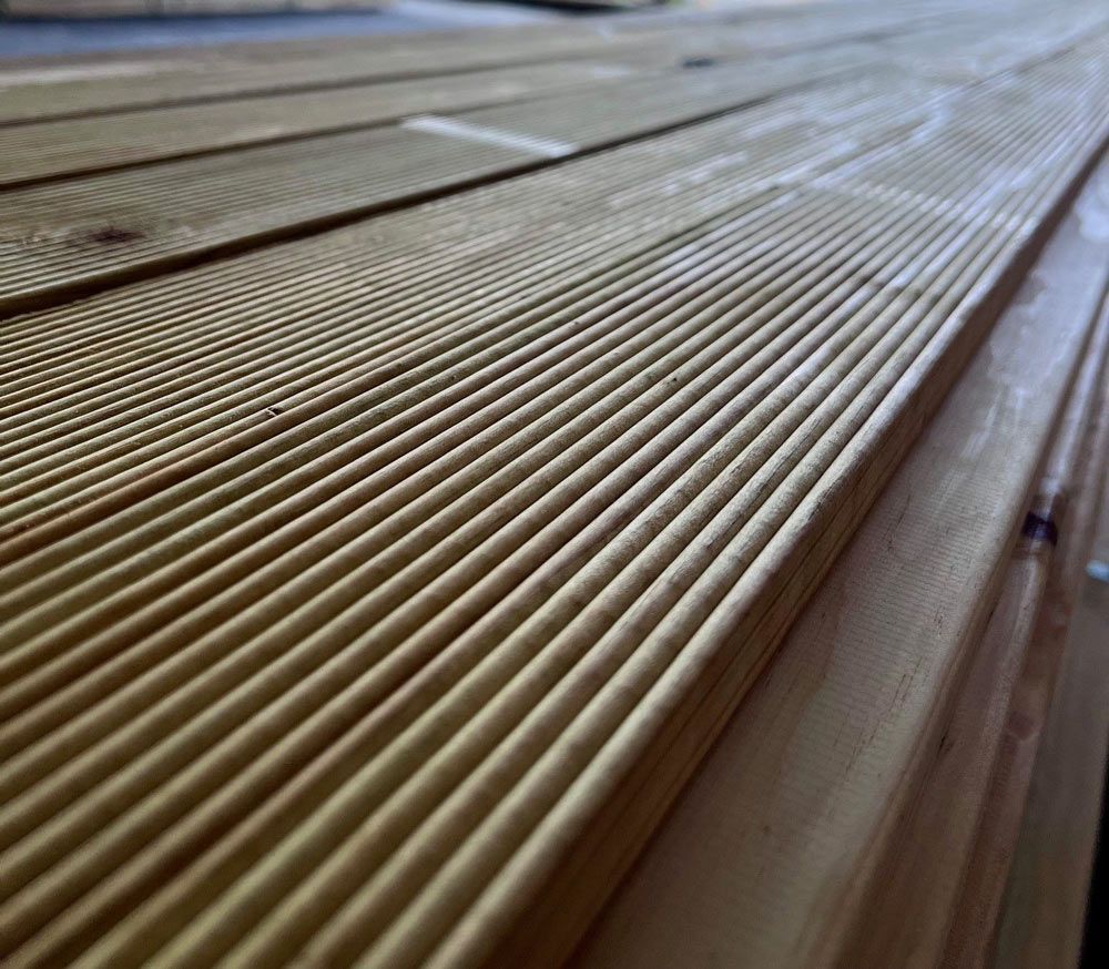 A Close Up of a Wooden Deck With a Striped Pattern — B & B Timbers Ballina In West Ballina, NSW