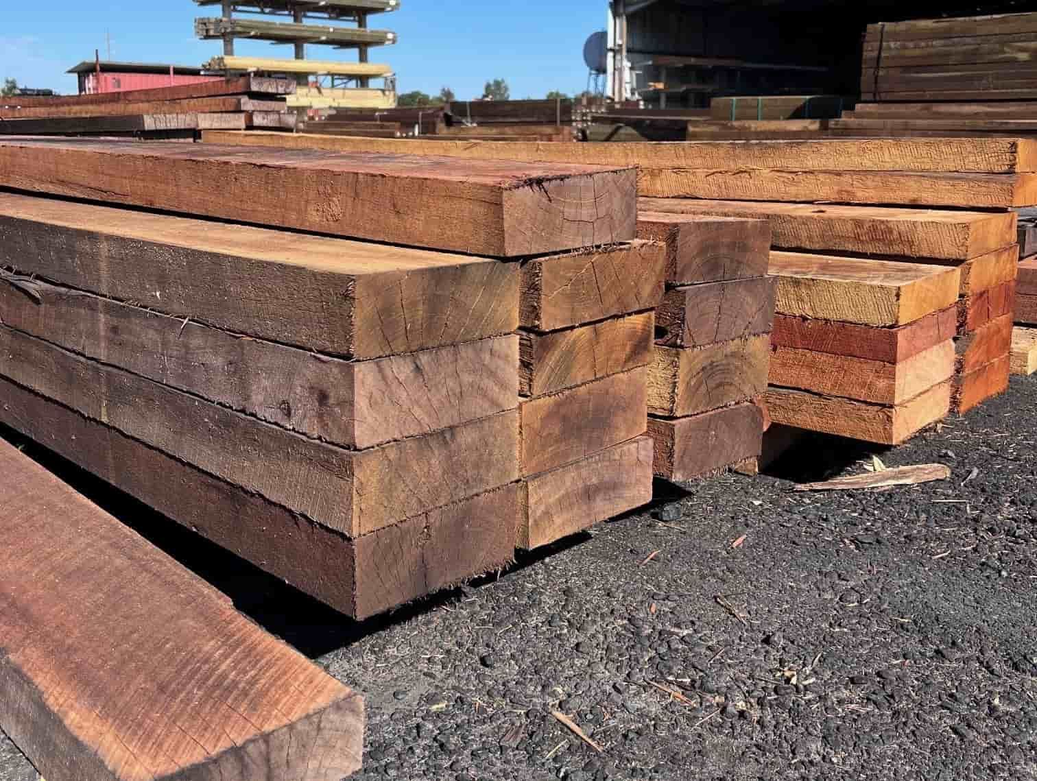 A Pile of Wooden Beams Stacked on Top of Each Other — B & B Timbers Ballina In West Ballina, NSW