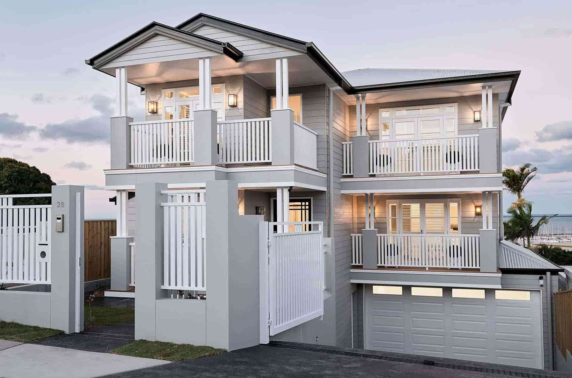 A Large White House With a White Fence in Front of It — B & B Timbers Ballina In West Ballina, NSW