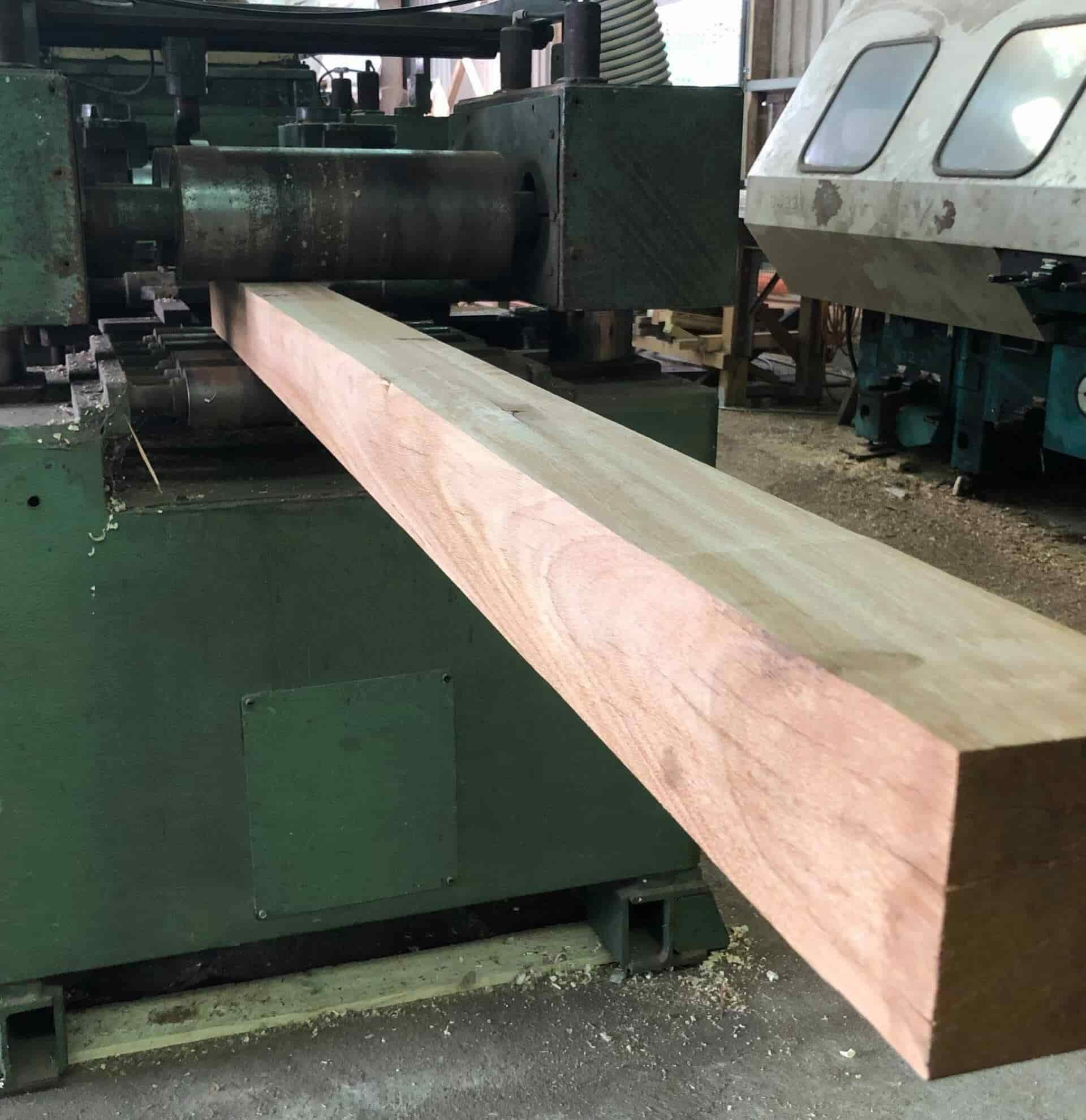A Large Piece of Wood is Sitting on Top of a Machine — B & B Timbers Ballina In West Ballina, NSW
