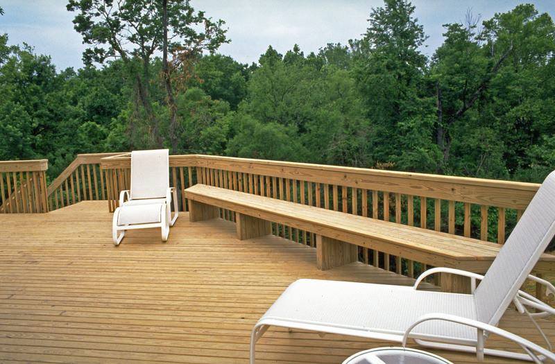 A Wooden Deck With a Bench and Chairs on It — B & B Timbers Ballina In West Ballina, NSW