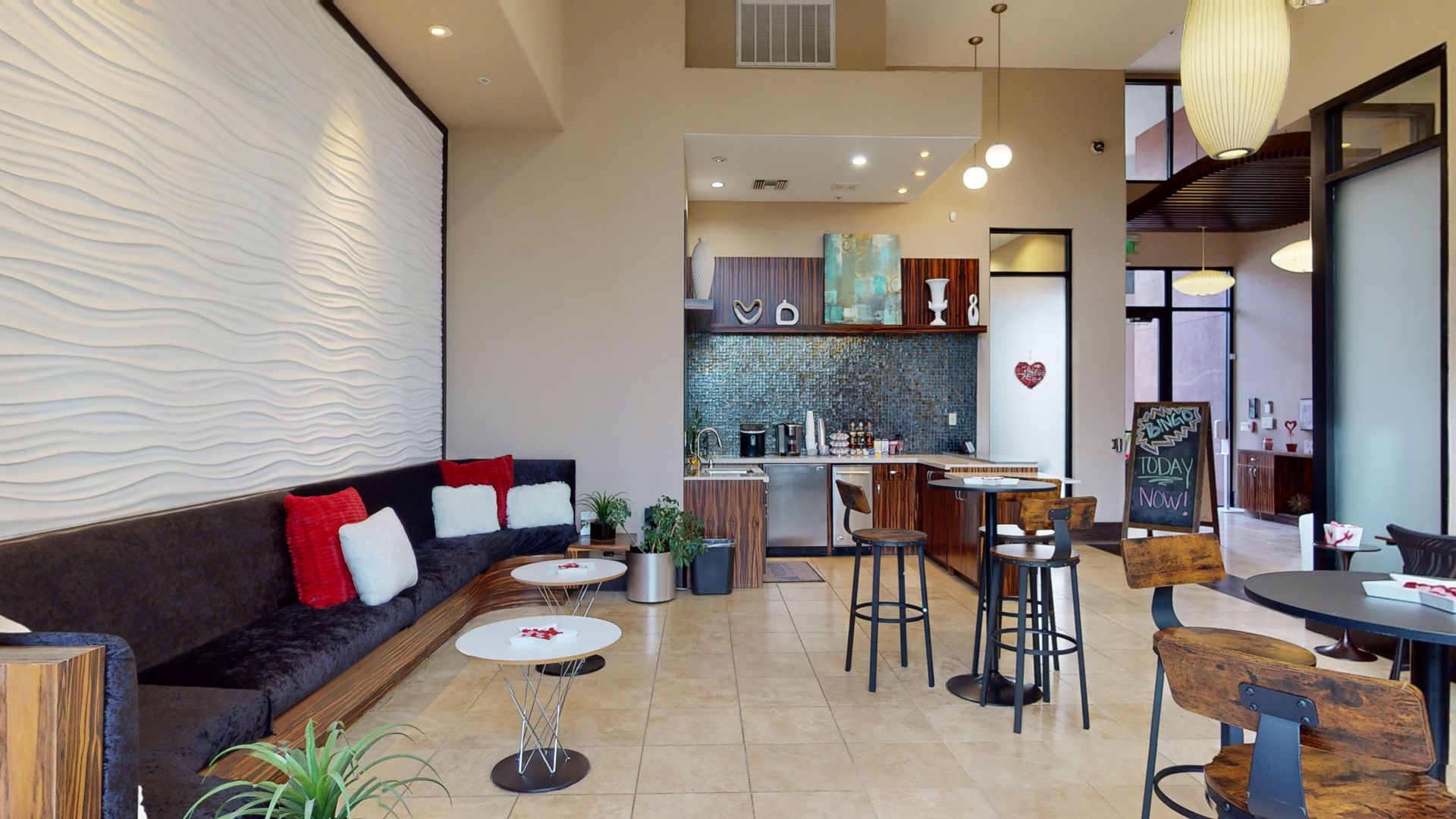 A living room with a couch , tables and chairs