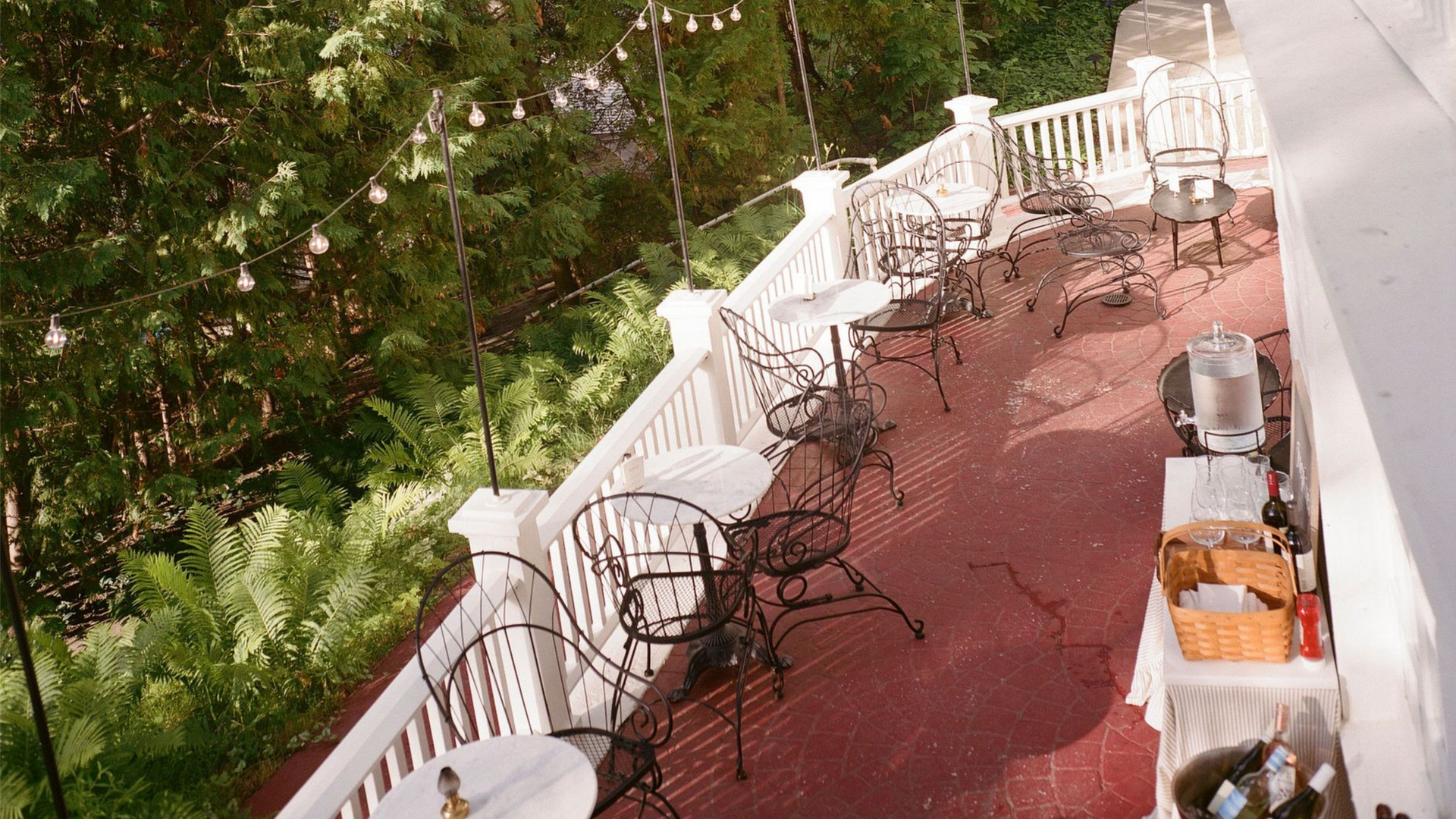 A group of people wearing face masks are toasting with champagne glasses.