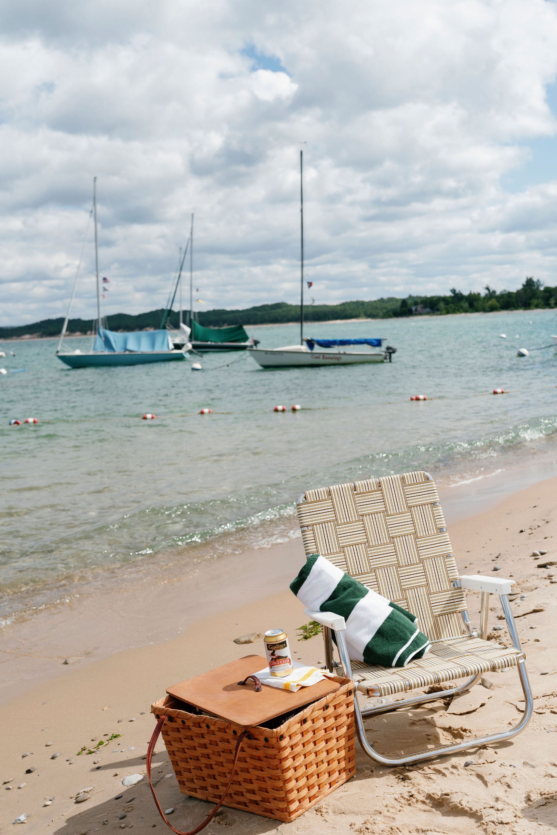 a pan filled with shrimp , mussels , peppers and rice on a wooden table .