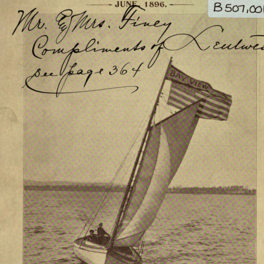 A black and white photo of a sailboat with a flag that says bay view