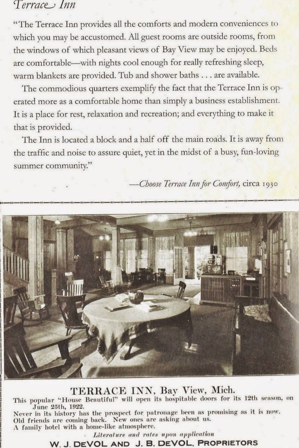 A black and white photo of a room with a table and chairs