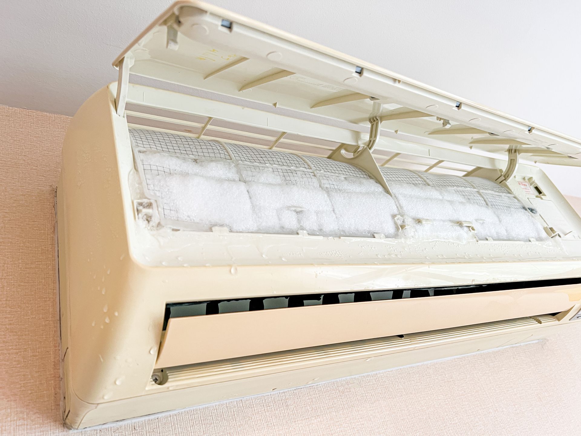 Closeup of AC with frozen interior panel, ready for repair.