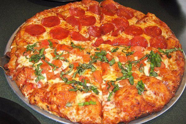 Half Pepperoni and half Margherita pizza