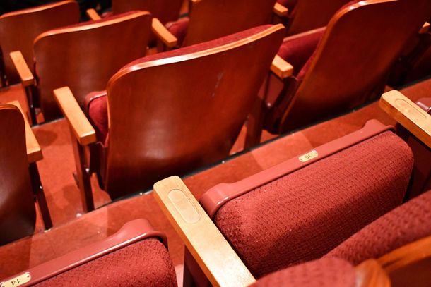 Rows of empty red theater seats viewed from above Rows of empty red theater seats viewed from above