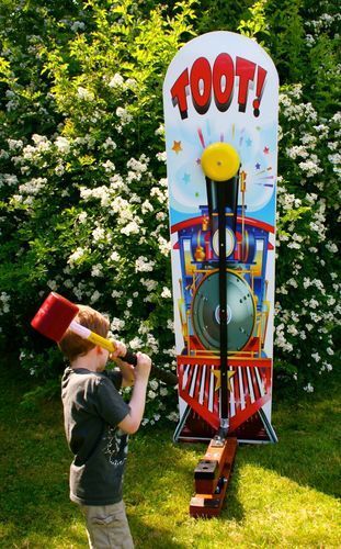 A young boy is playing a game called toot.