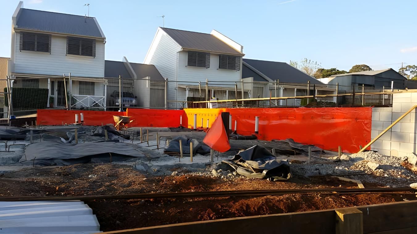 Construction Site With a Red Termite Barrier — Keiran Mortimer Pest Control in Crows Nest, QLD