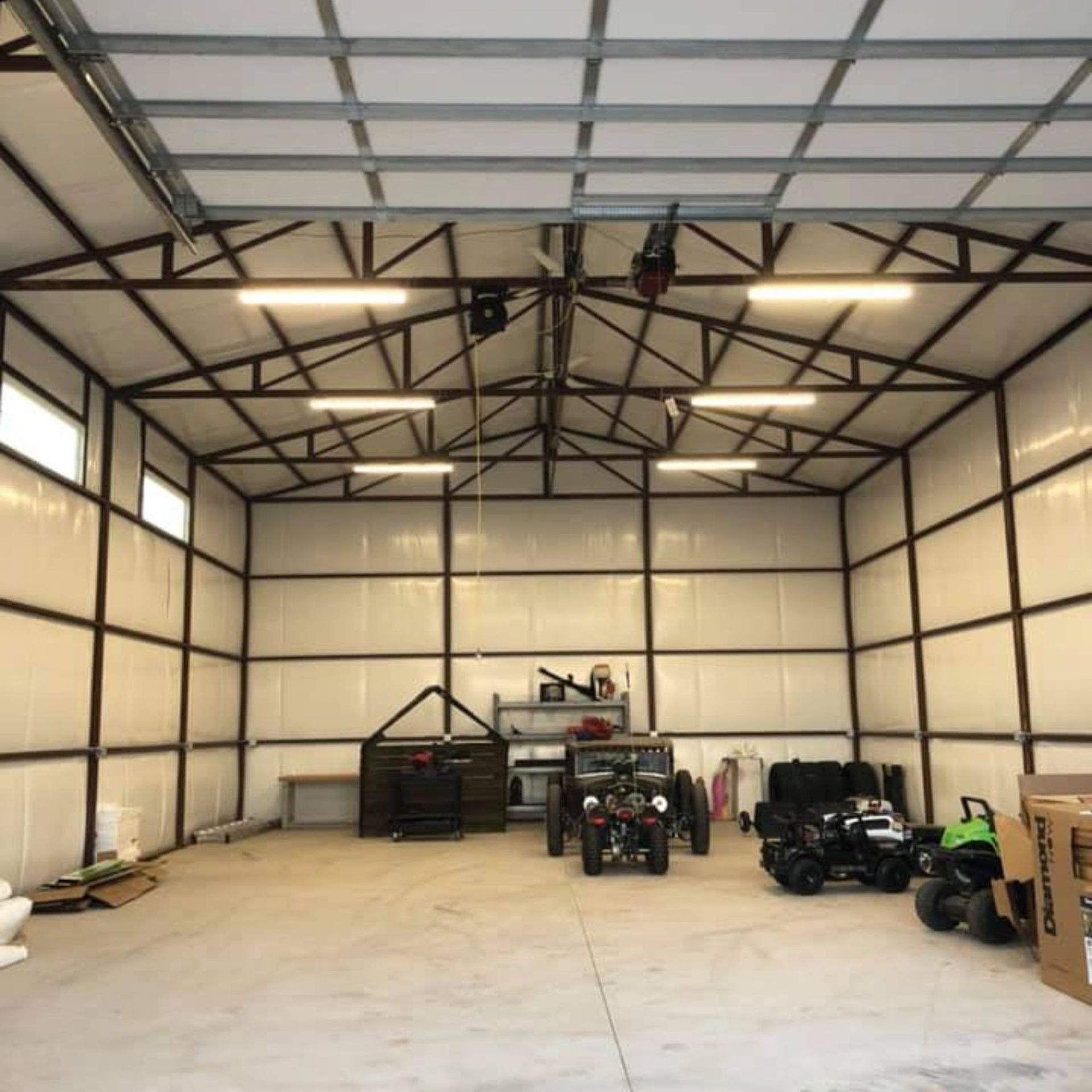 Harrington Electric LLC - A garage with a lot of vehicles inside of it