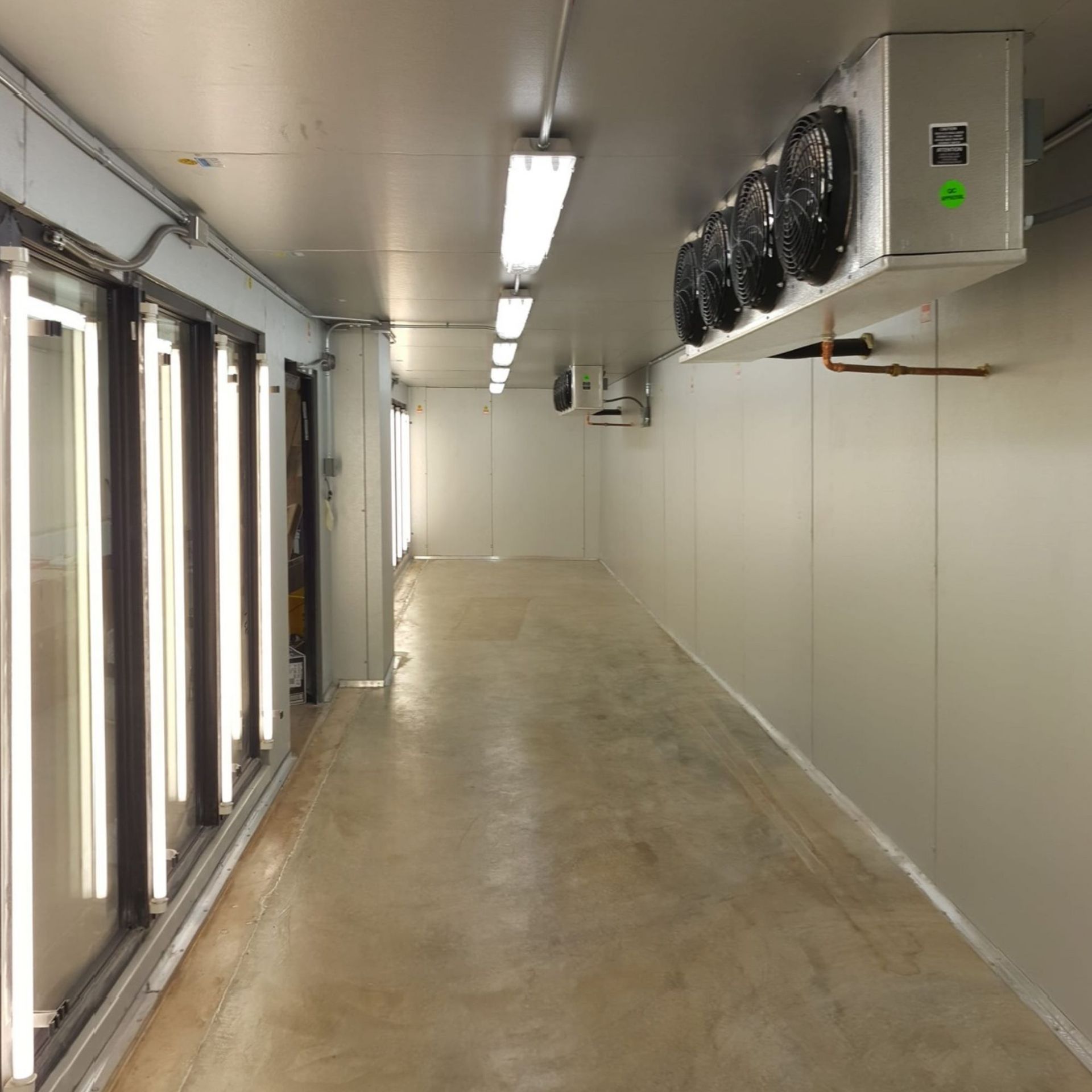 Harrington Electric LLC - A long hallway with a green sticker on the ceiling