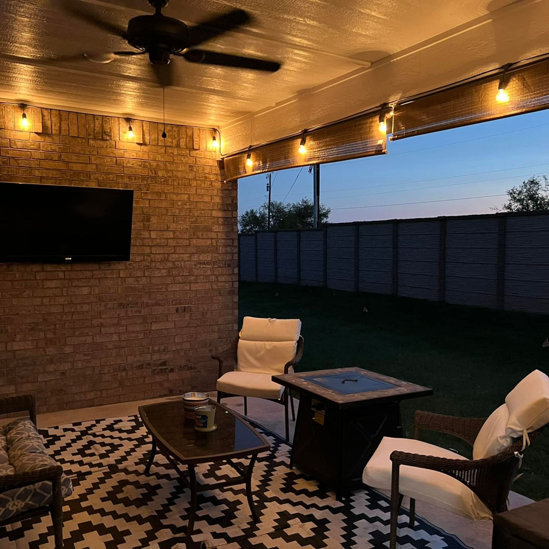 Harrington Electric LLC - A living room with a ceiling fan and a flat screen tv.