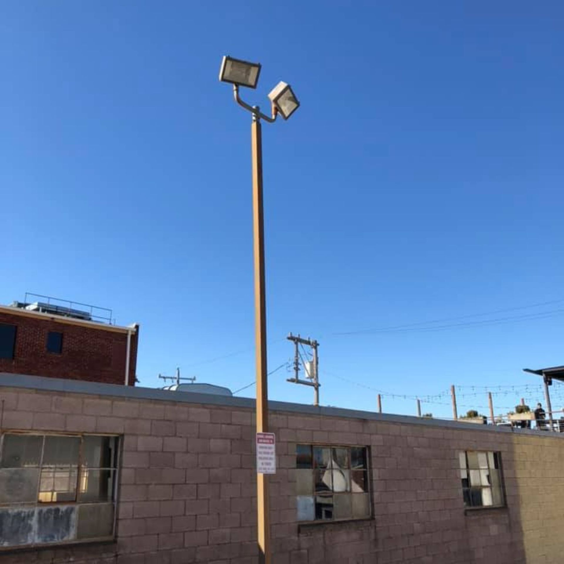 Harrington Electric LLC - A street light with a no parking sign on it