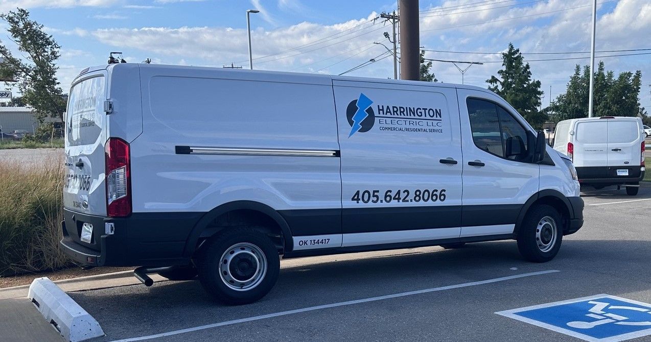Harrington Electric LLC - Two construction workers are working on a ceiling in a building.