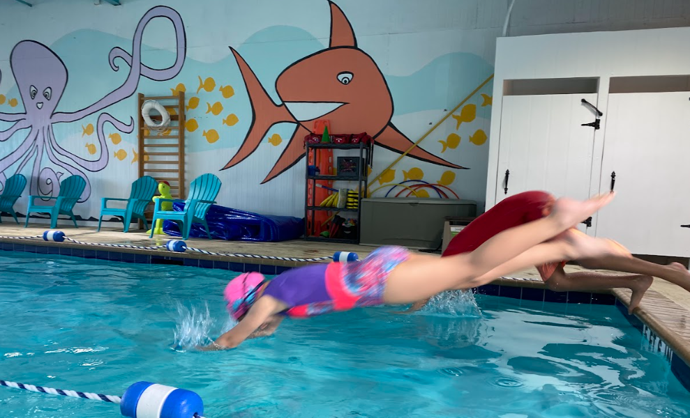 Girl diving into a swimming pool