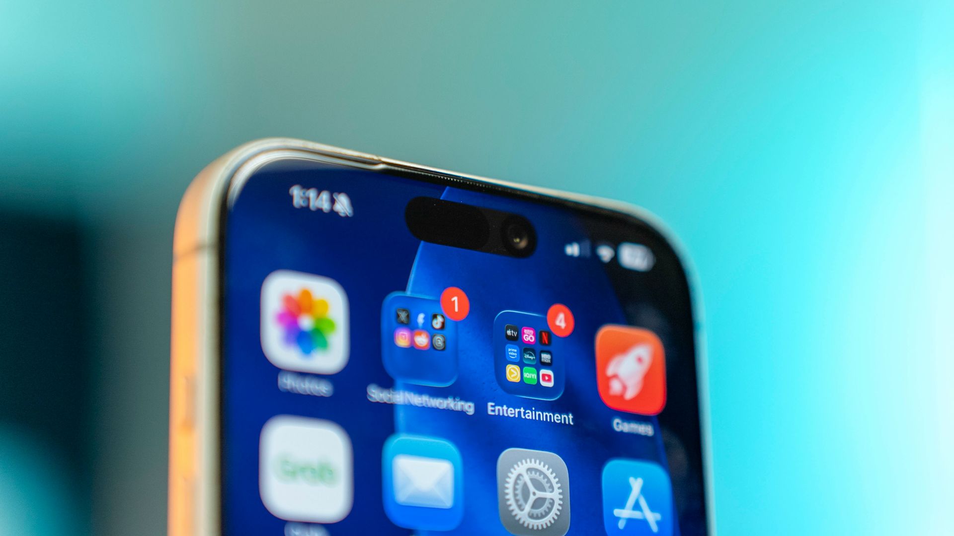 iPhone home screen with organized apps and notification badges