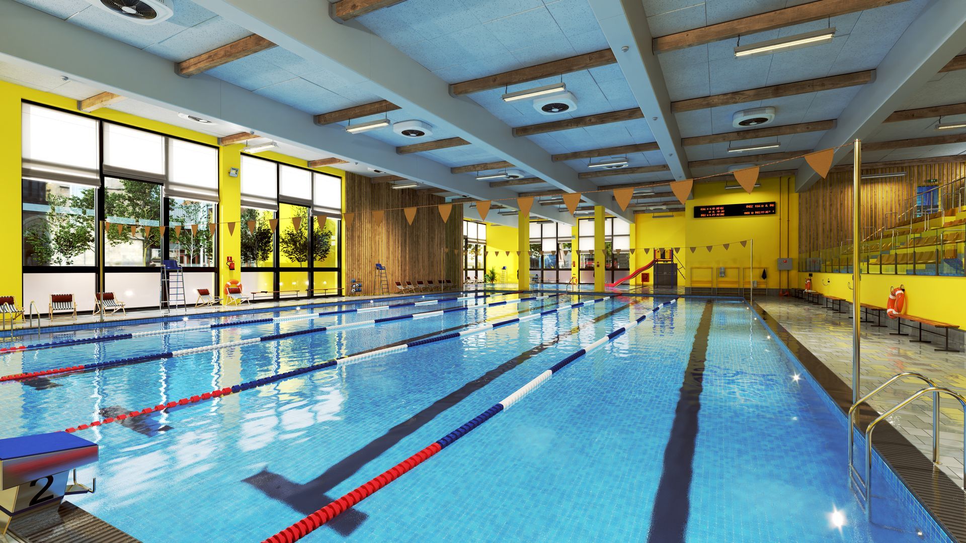 An indoor pool with yellow walls and swim lanes