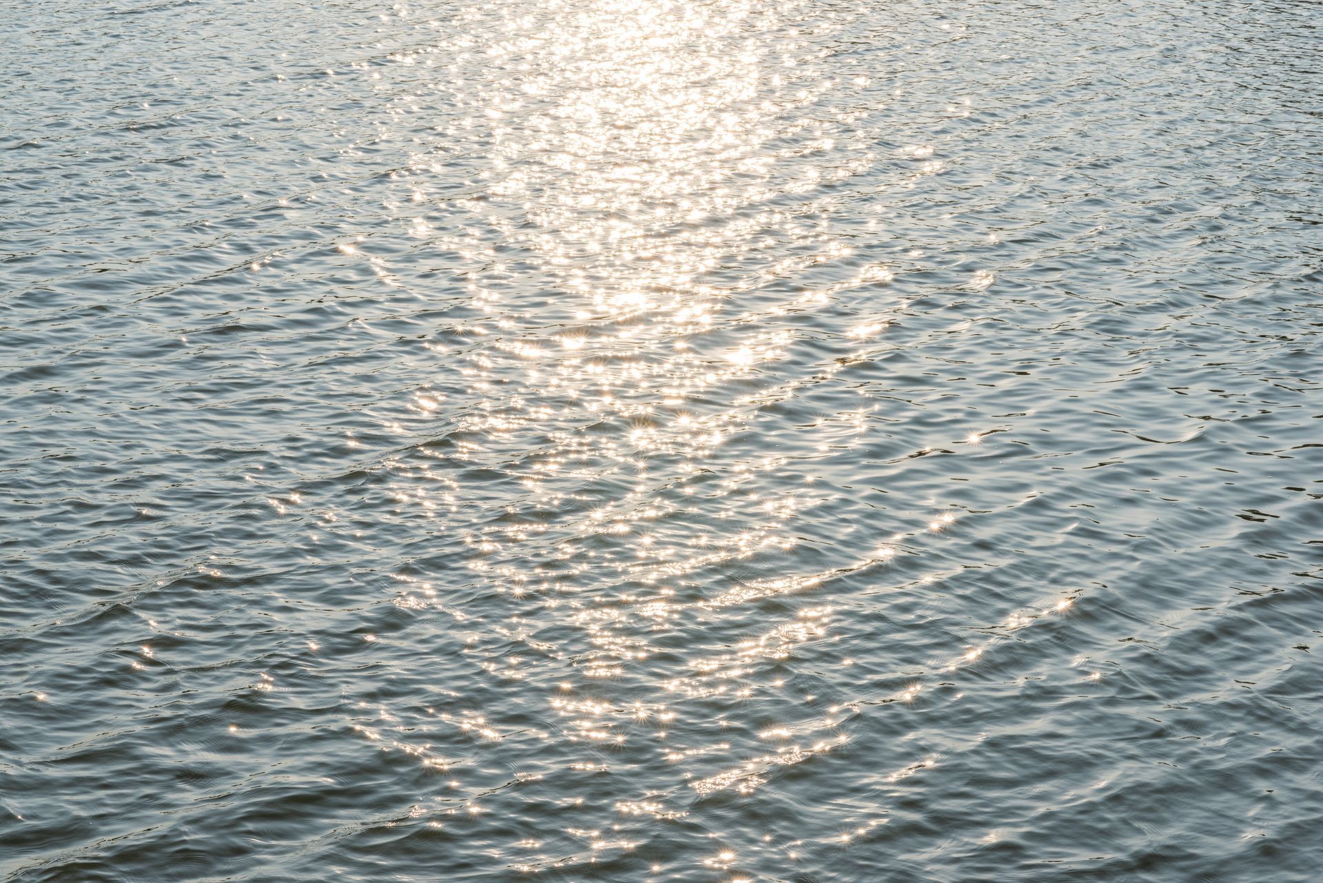 Open water with a reflection of sunlight