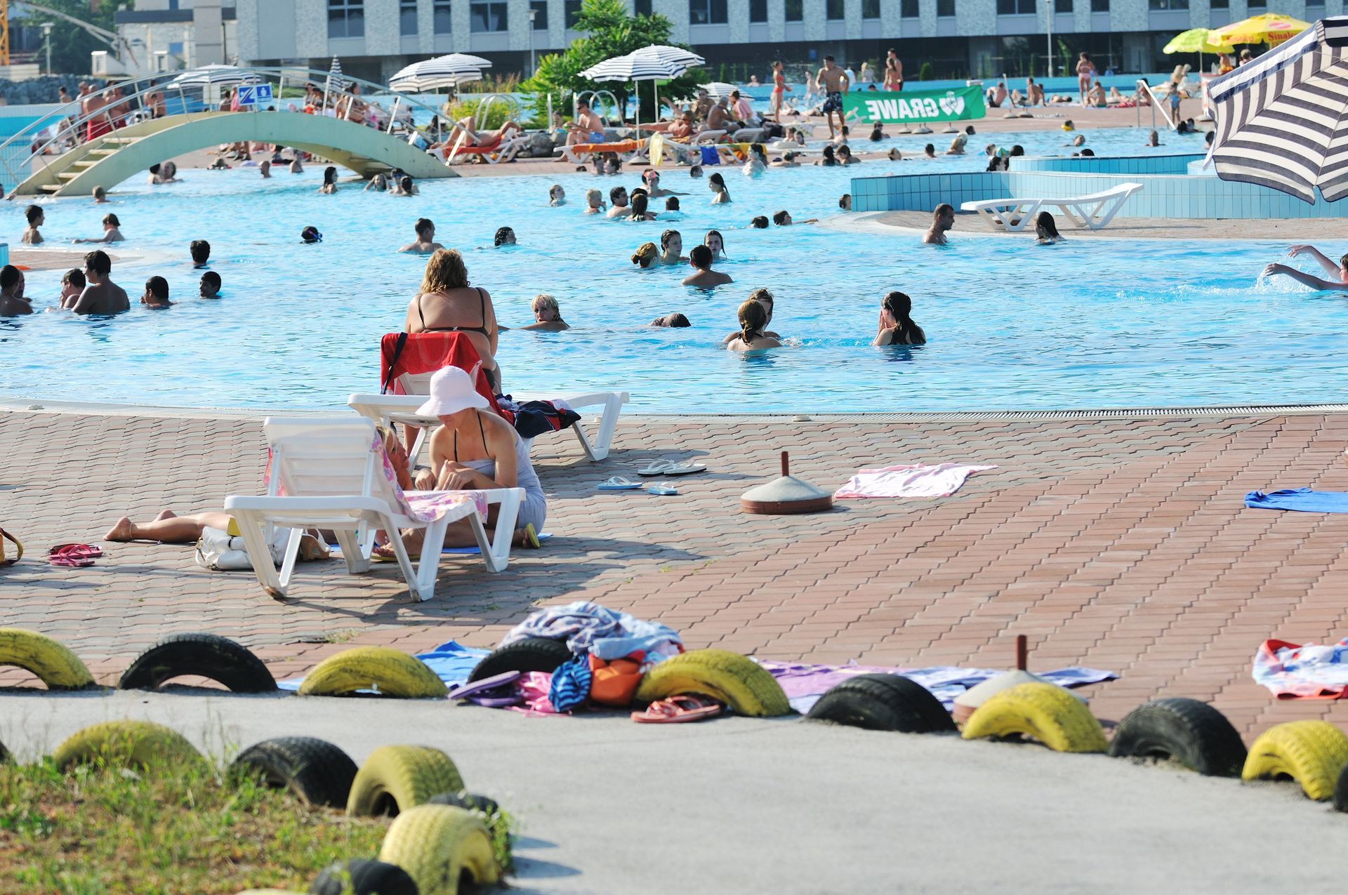 A variety of people at a public swimming pool