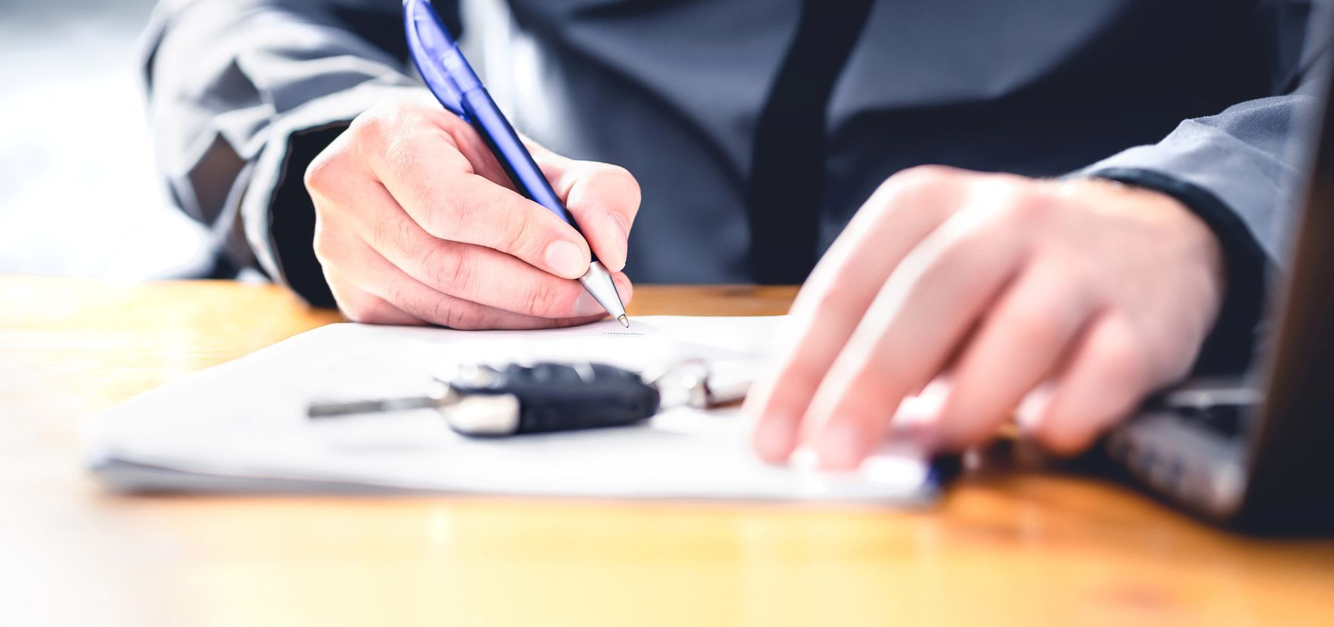 Student signing contract to begin heavy vehicle license training course