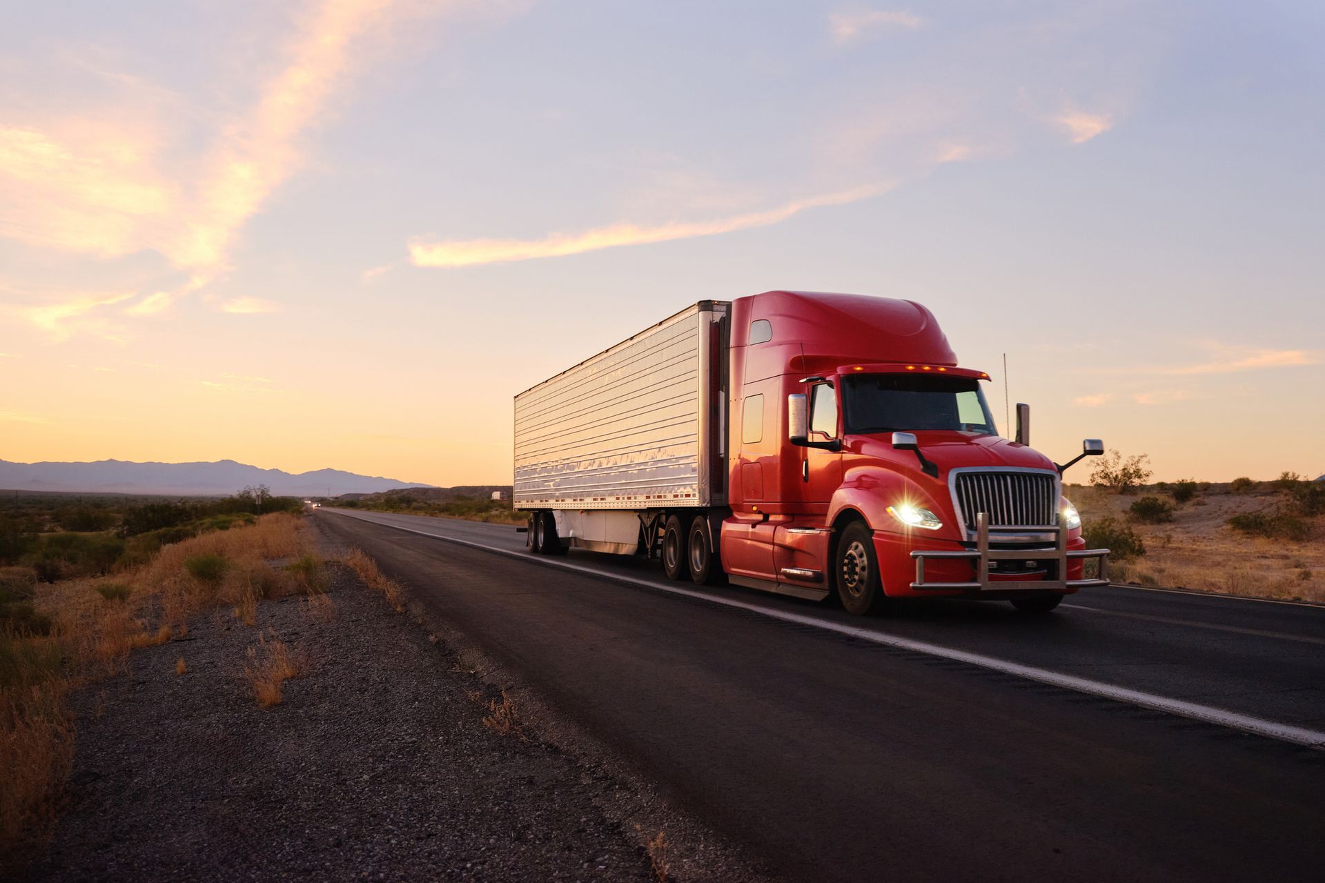 Large semi-truck hauling freight on the open highway.