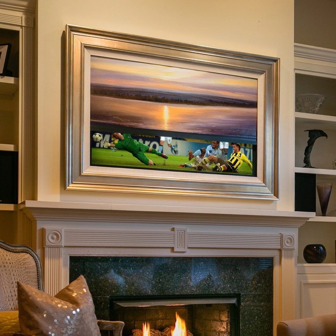A framed painting of a soccer game above a fireplace.