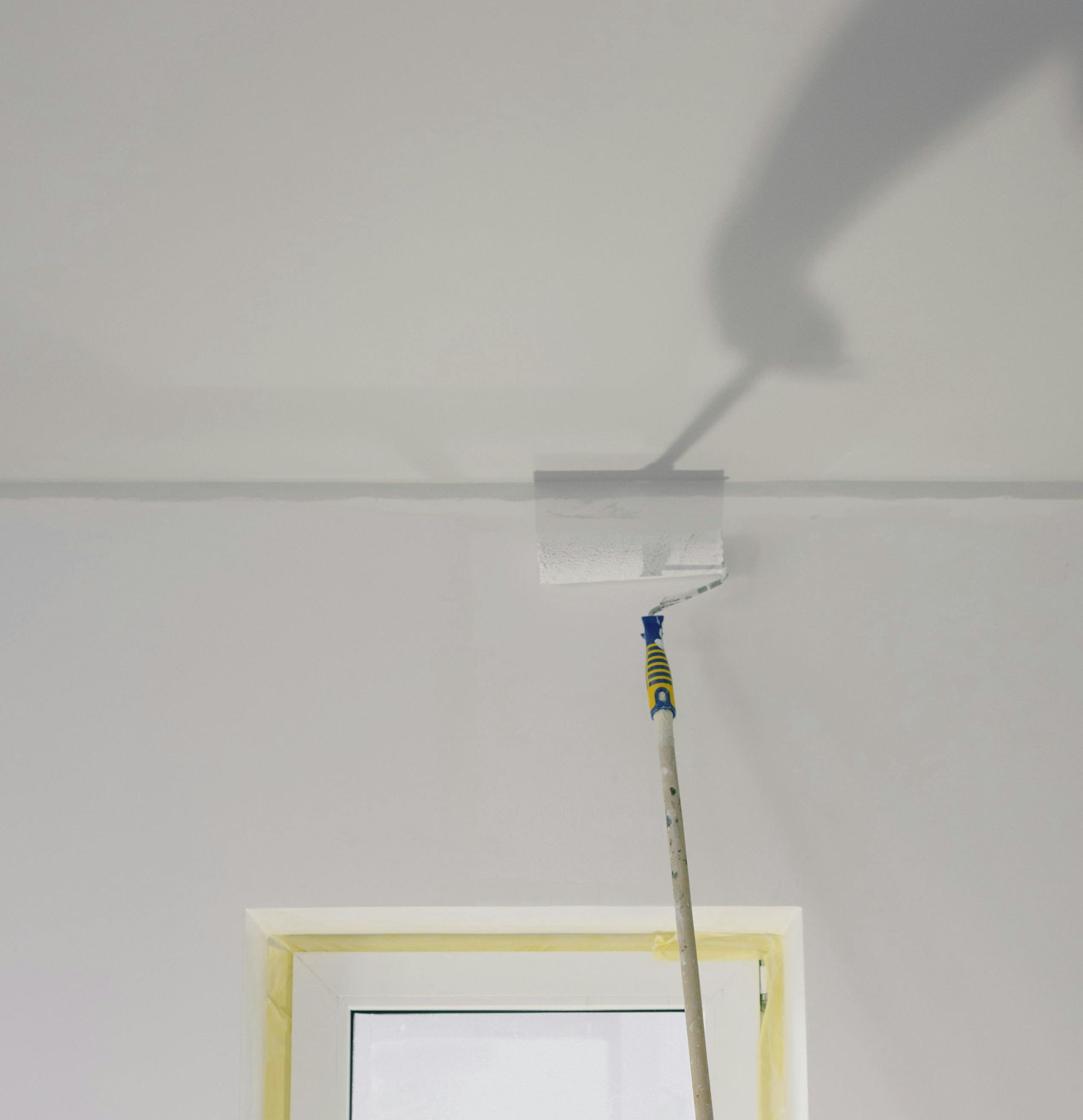 A bathroom with two sinks , a tub , and wicker baskets.