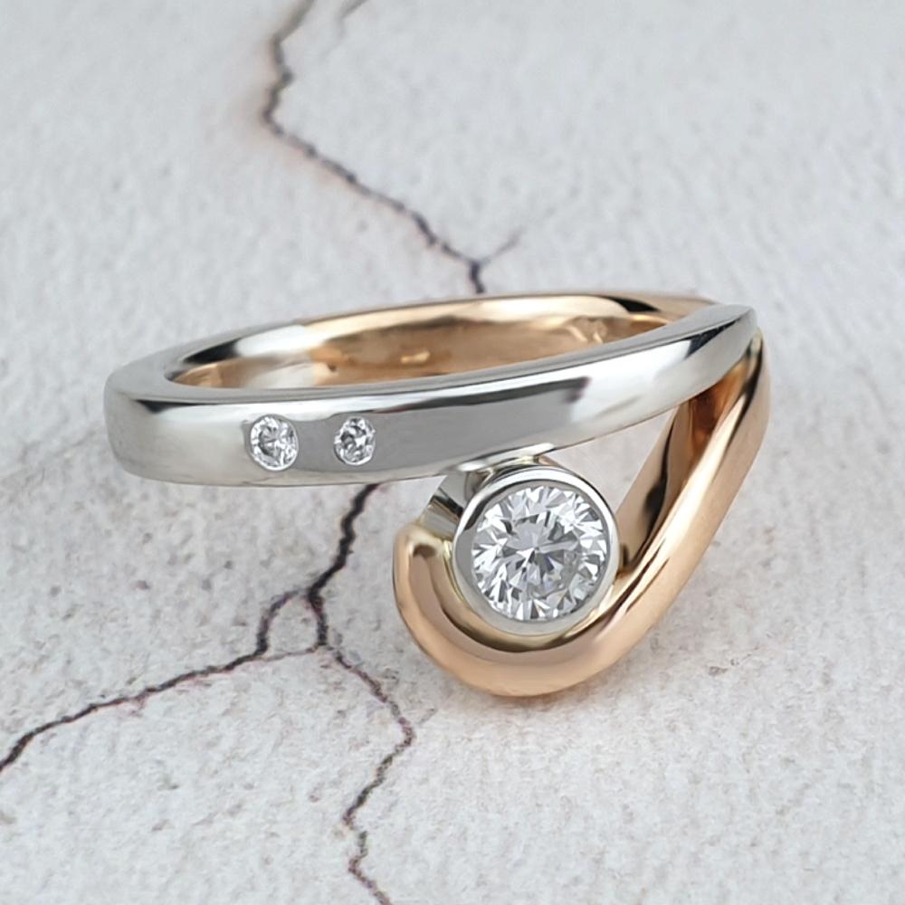 Platinum and red gold with round diamond