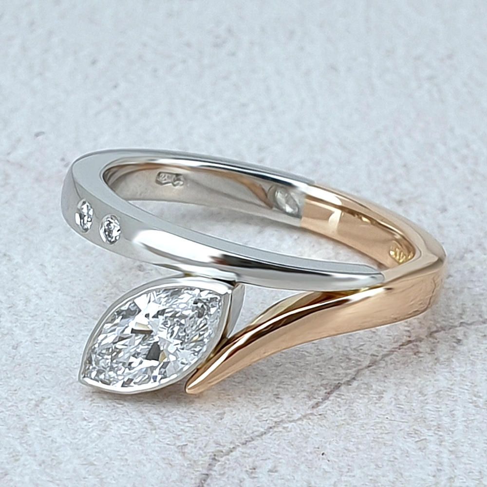 Bespoke engagement ring with a marquise diamond