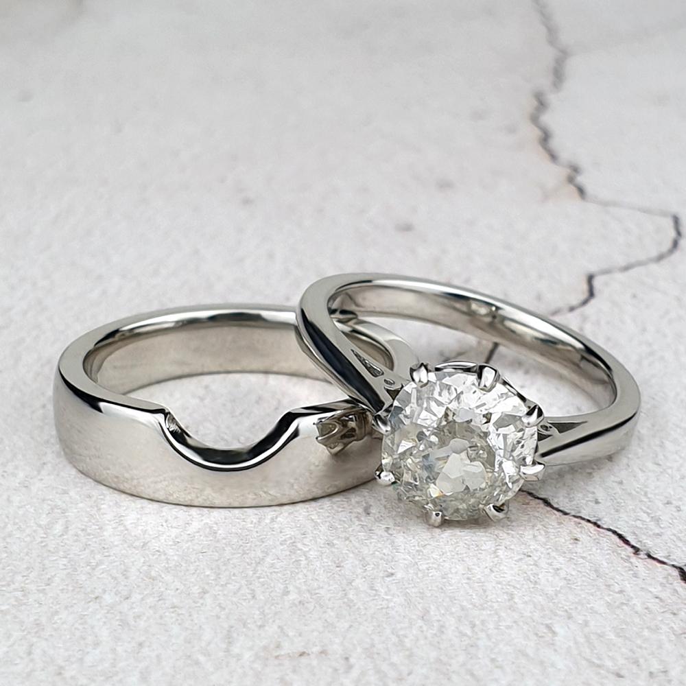 Wide plain band cut to fit the solitaire engagement ring