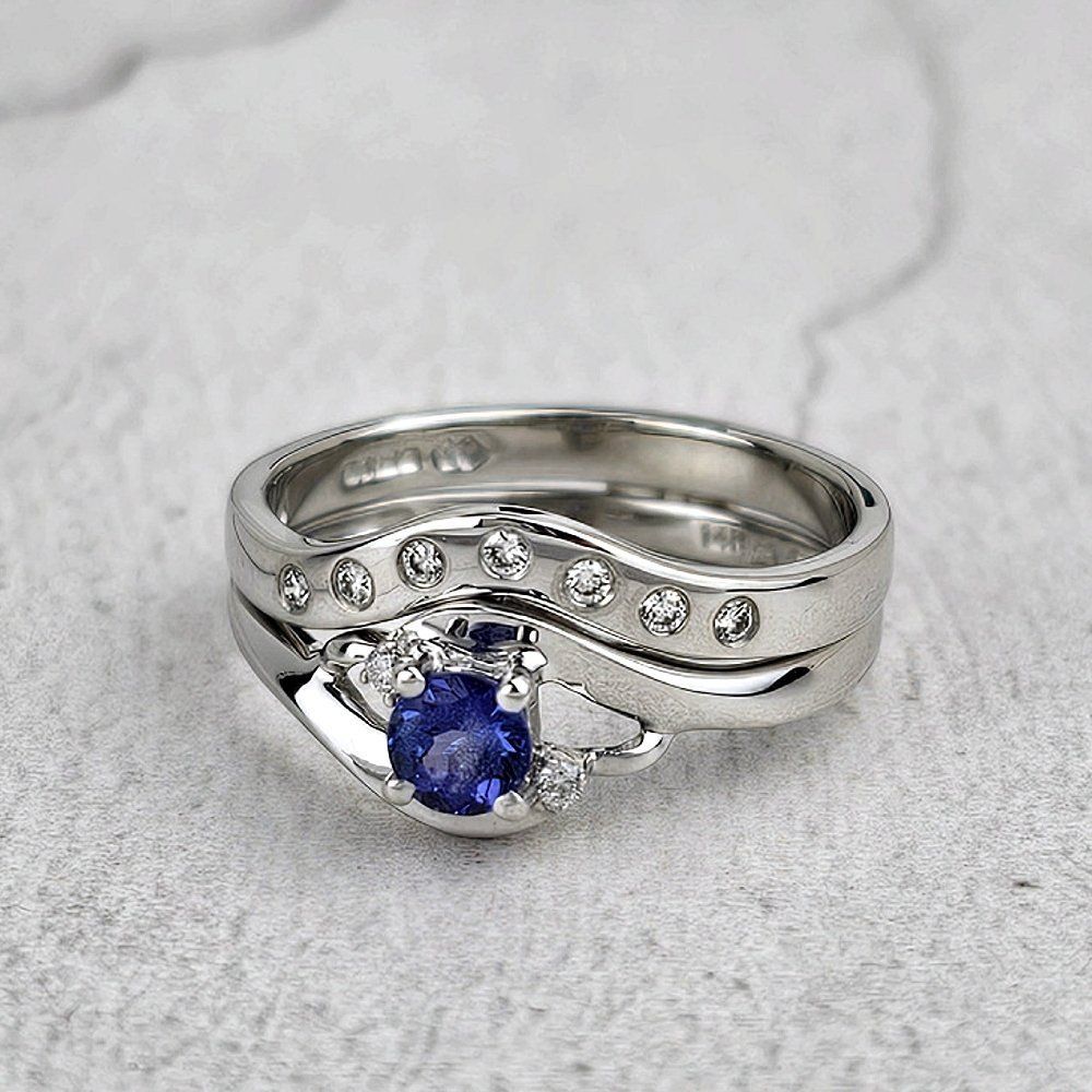 a small fitted wedding ring with the engagement ring