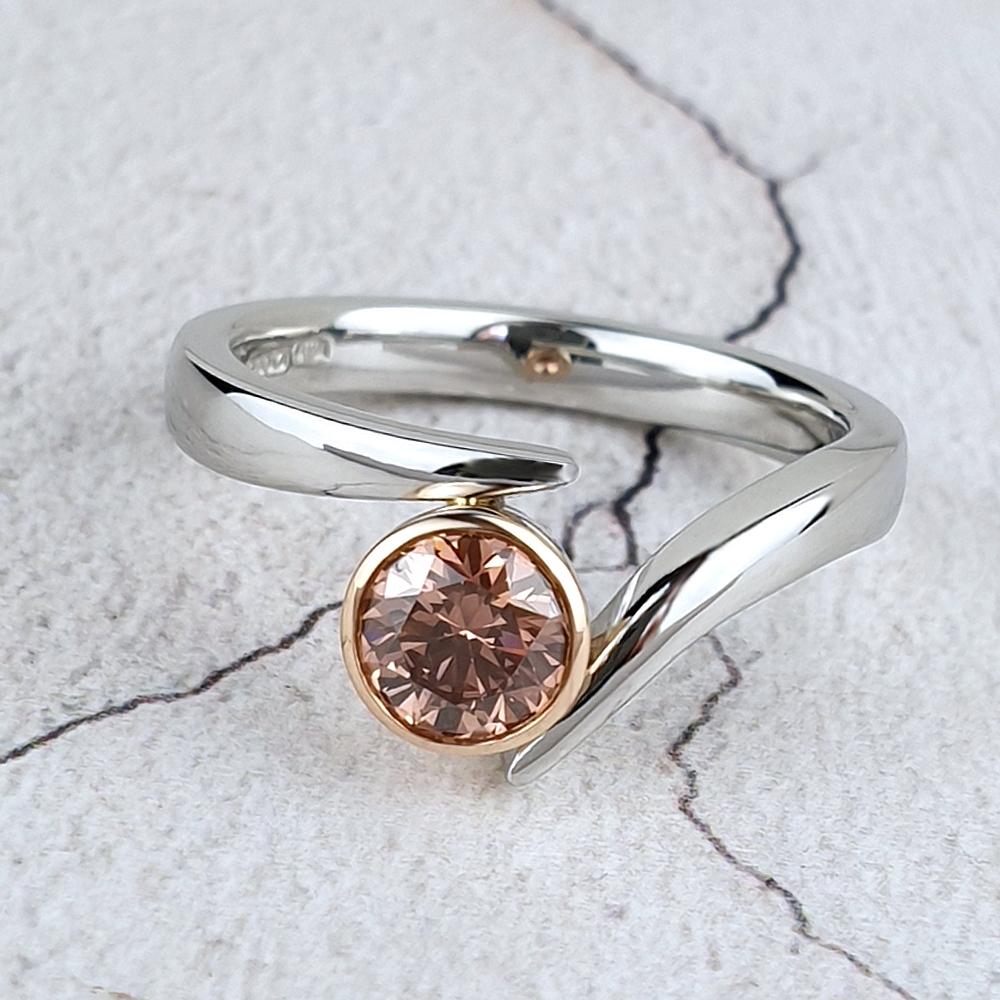 Platinum ring with a brown diamond