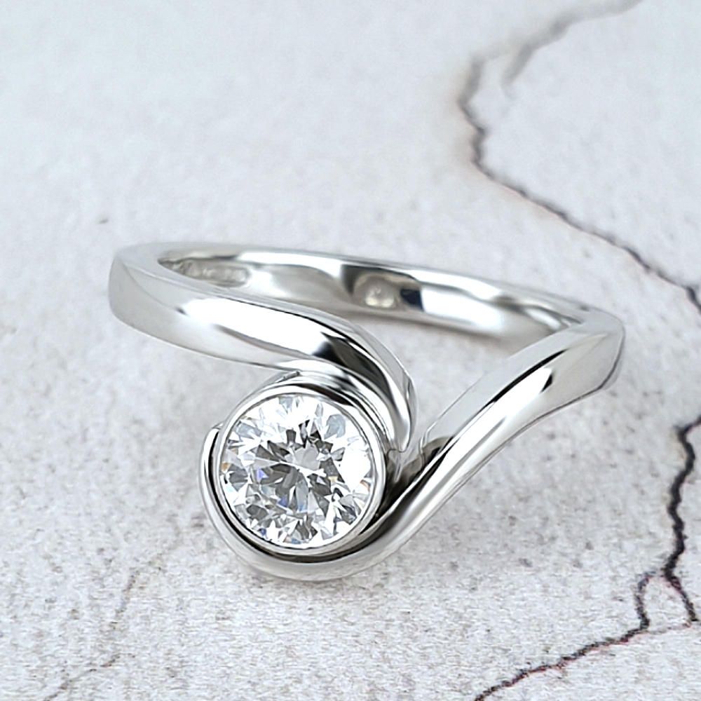 Infinity engagement ring with a marquise diamond