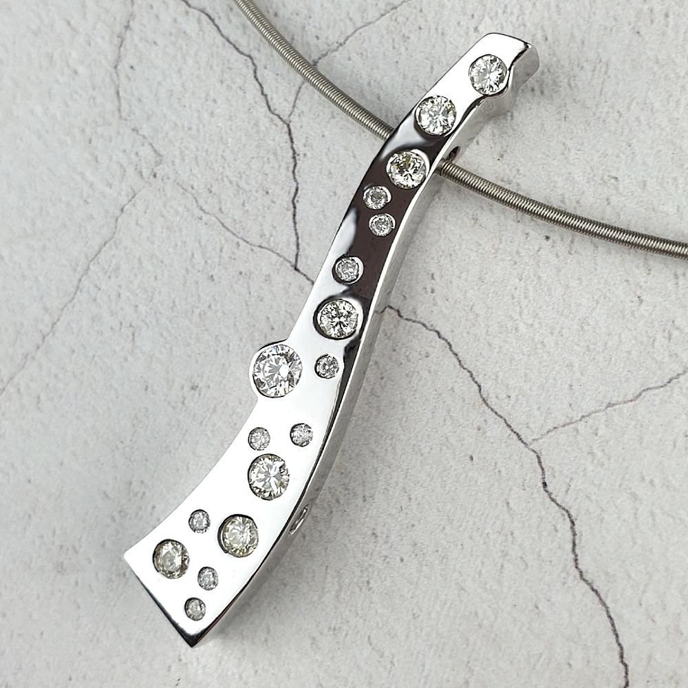 A reversible pendant with scattered diamonds