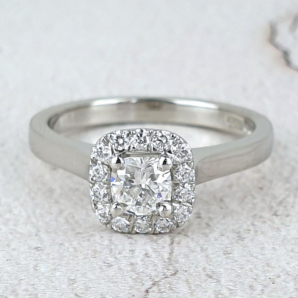 Platinum Halo engagement ring with cushion diamond