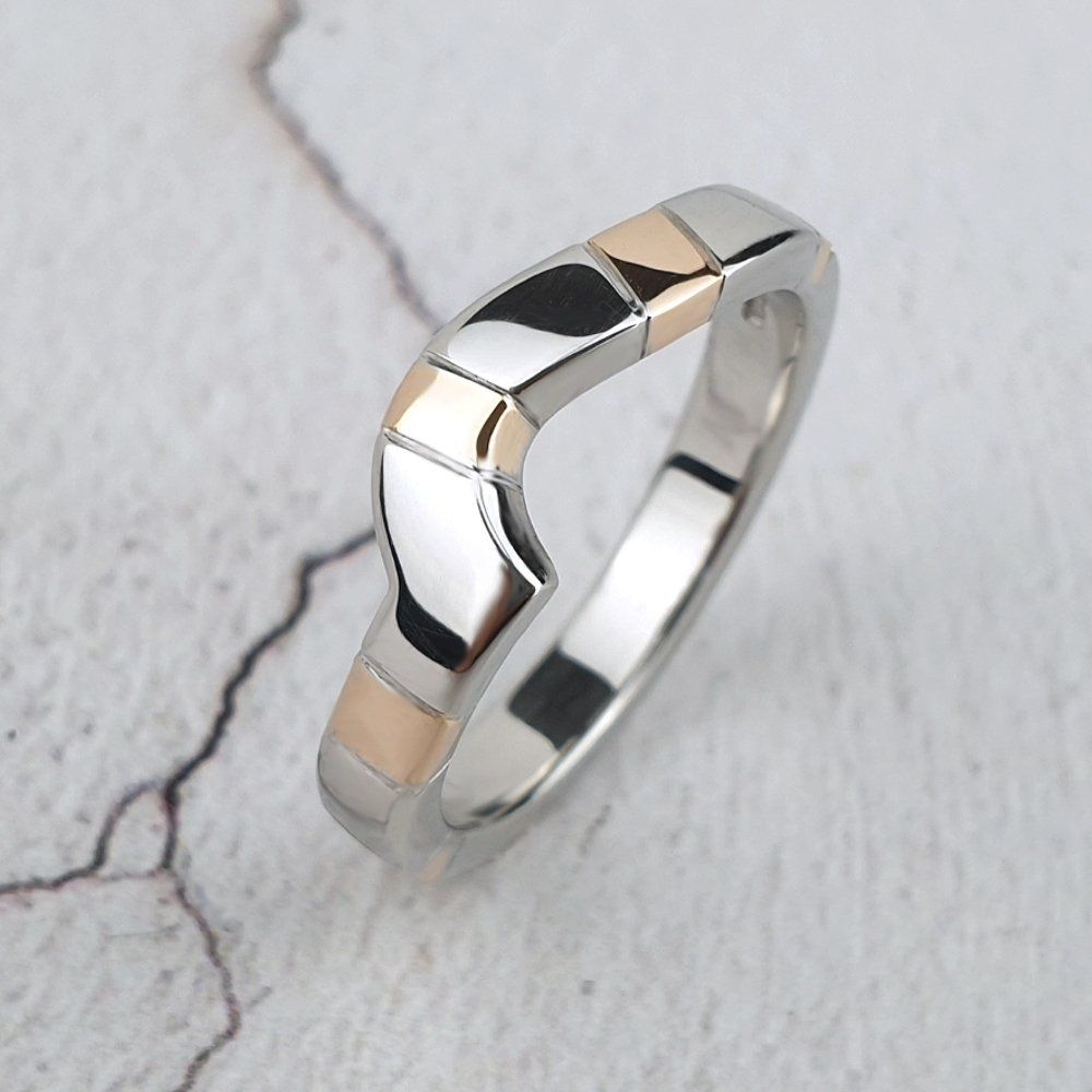 fitted platinum wedding ring with red gold stripes