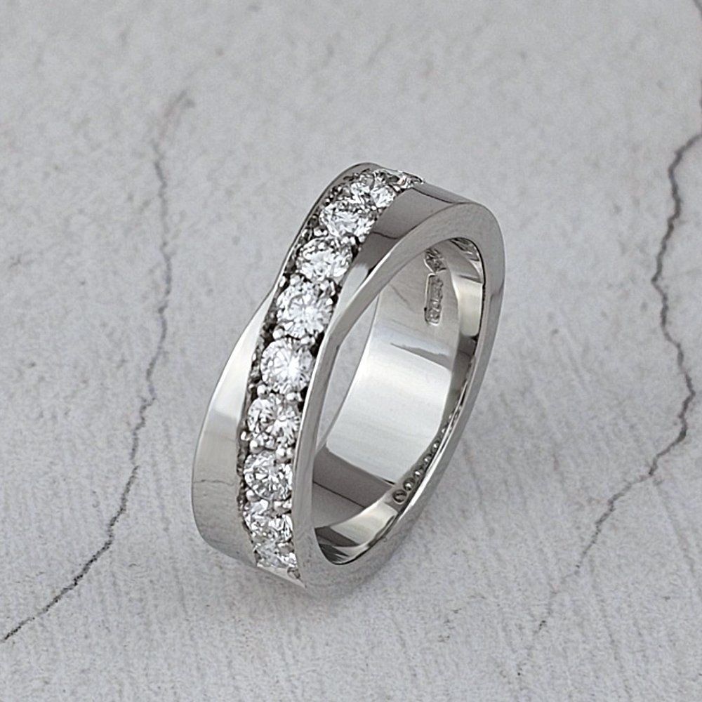 A wide platinum band with a diagonal line of diamonds
