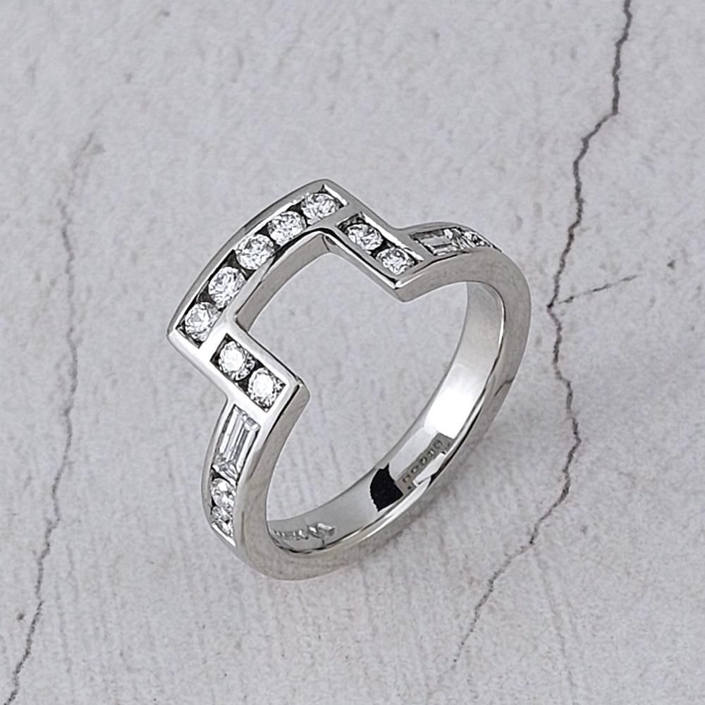 a platinum fitted wedding ring with round and baguette diamonds