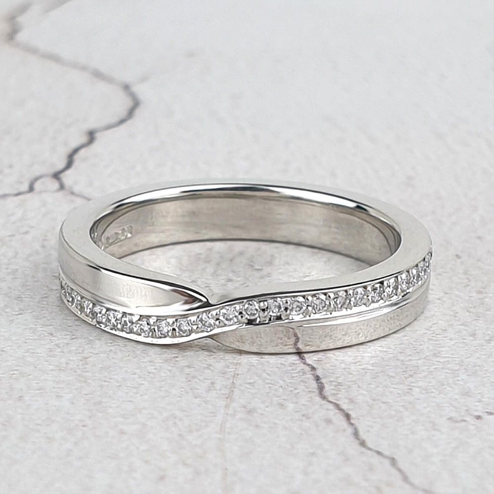 Crossover eternity ring with small diamonds