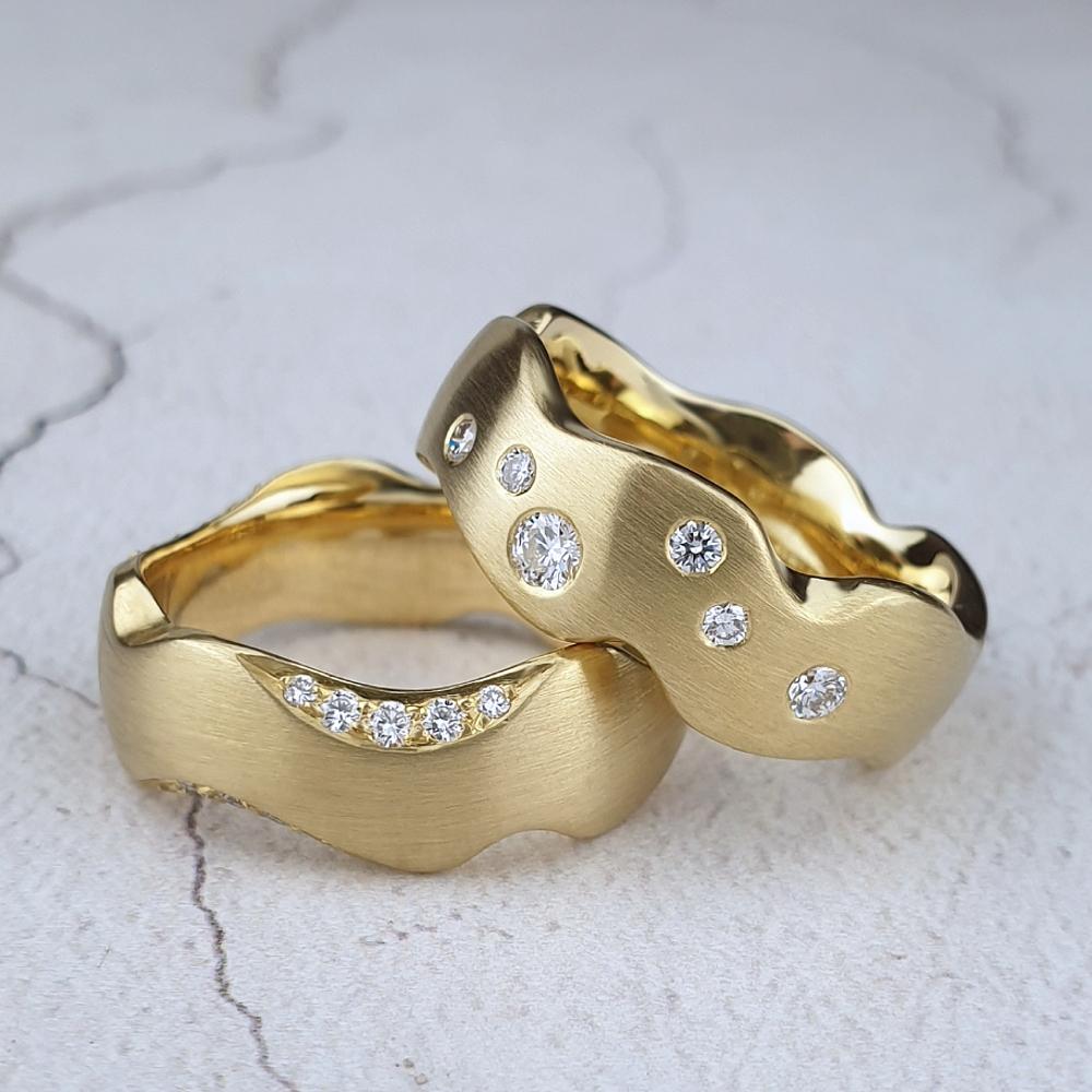 Carved wedding rings with diamonds
