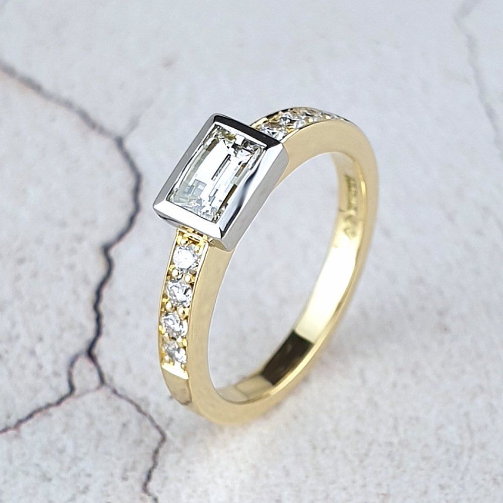 Remodelled engagement ring with a baguette diamond